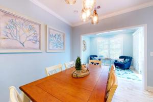 a dining room with a wooden table with chairs and a dining room at Bayside Resort 2639zero Seabreeze Lndg in Selbyville