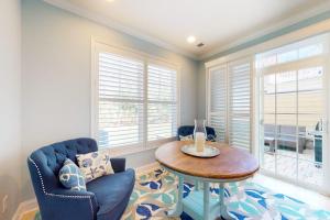 a living room with a table and chairs and windows at Bayside Resort 2639zero Seabreeze Lndg in Selbyville +42 photos