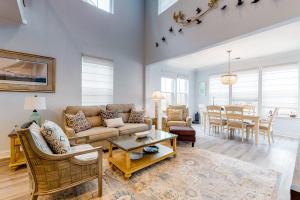 a living room with a couch and a table at Bayside Resort - 28031 Sea Dock in Selbyville