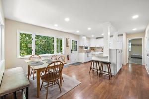 a kitchen and dining room with a table and chairs at Heron Hideaway in Wilkesboro
