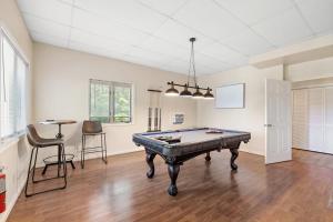 a living room with a pool table in it at Heron Hideaway in Wilkesboro