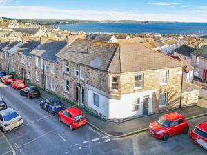 an aerial view of a city with cars parked in a parking lot at 2 Bed in Penzance oc-u34133 in Penzance