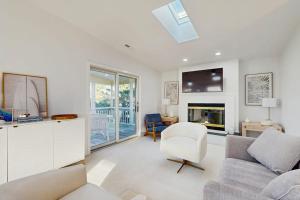 a living room with a couch and a tv at South Bethany --- 309 W 2nd St in Bethany Beach