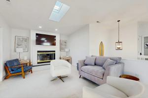 a living room with a couch and a chair at South Bethany --- 309 W 2nd St in Bethany Beach