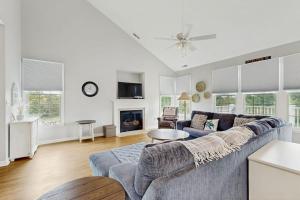 a living room with a couch and a fireplace at Bear Trap Dunes --- 124 October Glory Ave Unit #B in Ocean View +38 photos