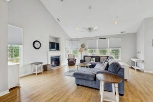 a living room with a couch and a table at Bear Trap Dunes --- 124 October Glory Ave Unit #B in Ocean View
