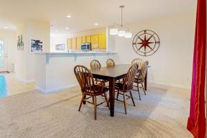 a kitchen and dining room with a table and chairs at Sea Colony --- 56200 Pine Cone Ln in Bethany Beach