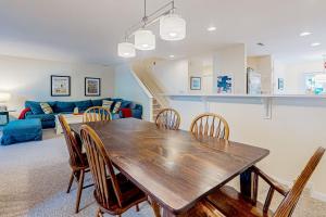 a dining room with a wooden table and chairs at Sea Colony --- 56200 Pine Cone Ln in Bethany Beach