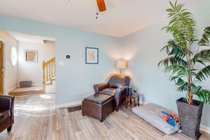 a living room with a chair and a plant at The Reservation --- 38601 Indian Trail in Ocean View