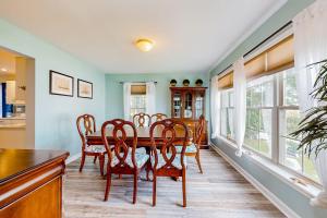 a dining room with a table and chairs at The Reservation --- 38601 Indian Trail in Ocean View +24 photos