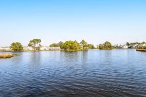 a large body of water with trees and houses at Mallard Lakes --- 38082 Mockingbird Ln Unit #48 in Selbyville