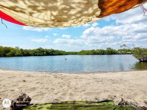 a view of a beach with a body of water at Poneloya Budget Accomodations in León
