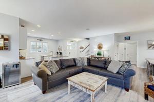 a living room with a couch and a table at 39609 Waterworks Ct in Bethany Beach