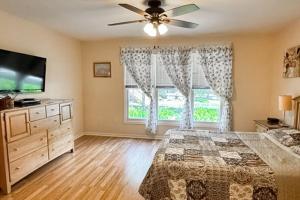 a bedroom with a bed and a tv and a window at Sea Colony --- 55032 Pine Lake Dr in Bethany Beach