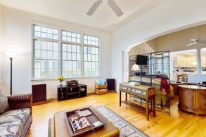 a living room with a couch and a table at Bear Trap Dunes - 53 October Glory Ave in Ocean View