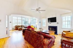 a living room with a couch and a fireplace at Bear Trap Dunes - 53 October Glory Ave in Ocean View