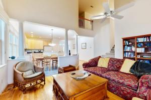 a living room with a couch and a table at Bear Trap Dunes - 53 October Glory Ave in Ocean View +31 photos