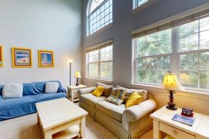a living room with a couch and a table at Wedgefield - 7 Saint George in Ocean View