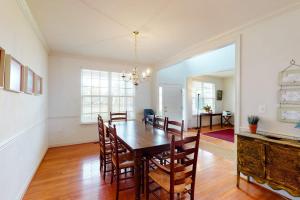 a dining room with a wooden table and chairs at Wedgefield - 7 Saint George in Ocean View +28 photos
