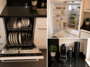 a kitchen with an open refrigerator with dishes at Central and well connected modern studio in Zurich
