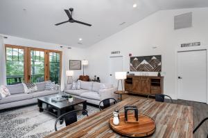 a living room with a couch and a table at Cardinal On Main in Blowing Rock