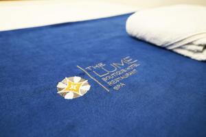 a blue bed with a star on top of it at The Lume Boutique Hotel & Restaurant & Spa in Bodrum City