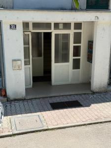 an entrance to a building with the doors open at Rosabell in Imotski