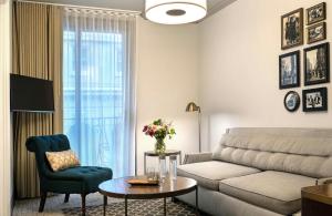 a living room with a couch and a table at Warwick San Francisco in San Francisco