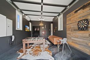 a living room with a table and a couch at Luxury Trails Escape in Boone