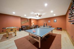 a living room with a ping pong table in it at Birds Nest On Sugar Mountain in Sugar Mountain