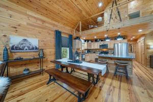 a kitchen with a table and chairs in a cabin at Pine Ridge Retreat in Beech Mountain +25 photos