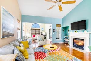 a living room with a couch and a fireplace at Bayview Landing - 38013 Bayview Circle in Selbyville