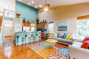 a living room with a couch and a kitchen at Bayview Landing - 38013 Bayview Circle in Selbyville
