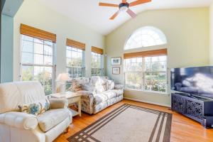 a living room with two couches and a flat screen tv at Bayview Landing - 38013 Bayview Circle in Selbyville +40 photos