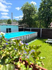 a swimming pool in the backyard of a house at Cottage RoKSa 2 з басейном in Slavske