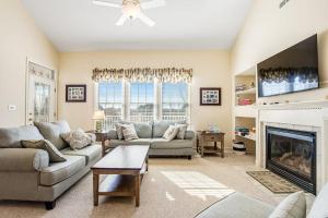 a living room with a couch and a fireplace at Bear Trap Dunes - 60F October Glory in Ocean View