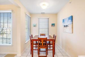 a dining room with a table and chairs at Bear Trap Dunes - 60F October Glory in Ocean View