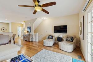a living room with a ceiling fan and a couch at Rehoboth Crossing --- 36985 Grindstone Ln in Rehoboth Beach