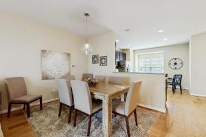 a dining room with a wooden table and chairs at Rehoboth Crossing --- 36985 Grindstone Ln in Rehoboth Beach