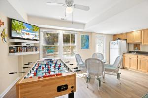a living room with a table with a chess board at 2020 - Merryweather in Sanderling