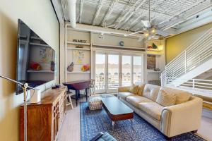 a living room with a couch and a tv at Rehoboth Beach --- Forj Lofts, Unit #2 in Rehoboth Beach