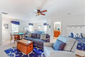 a living room with a couch and a table at Bear Trap Dunes - 15 Sycamore in Ocean View +57 photos