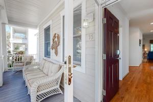 a living room with a couch and a door at Bear Trap Dunes - 15 Sycamore in Ocean View