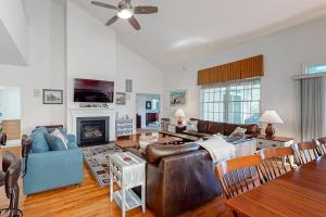 a living room with a couch and a fireplace at Bear Trap Dunes - 15 Sycamore in Ocean View