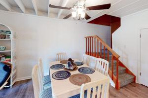 a dining room with a table with chairs and a ceiling fan at Mallard Lakes -- 38243 Cardinal #115 in Selbyville