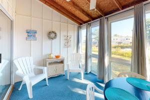 a dining room with white chairs and a table at Mallard Lakes -- 38243 Cardinal #115 in Selbyville