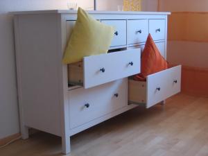 a white dresser with pillows on top of it at Ferienwohnung-VS in Villingen-Schwenningen