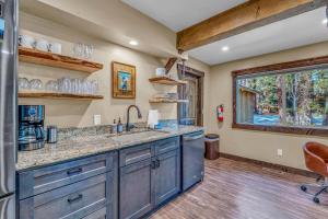 a kitchen with a sink and a large window at 3BD with Hot Tub Two Minutes from King Beach in Tahoe Vista