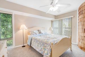 a bedroom with a bed and a ceiling fan at Sea Colony - 802 Wimbledon in Bethany Beach +40 photos