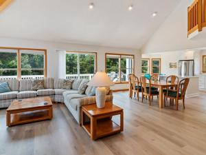 a living room with a couch and a table at 4160 - Shipley in Kitty Hawk